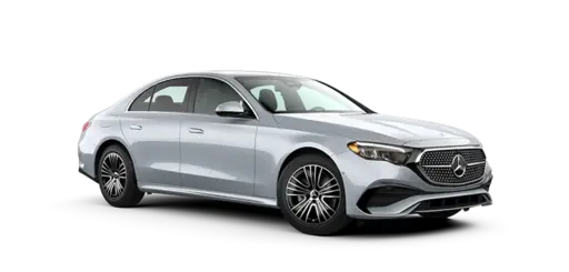 A silver Mercedes-Benz sedan with a sleek design, featuring a prominent grille, sleek headlights, alloy wheels, and black accents on the bumpers, displayed against a black background.