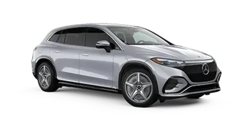 Silver Mercedes-Benz EQB electric SUV, a luxury compact crossover with sleek modern design, panoramic sunroof, alloy wheels, and the iconic Mercedes three-pointed star emblem on the front grille. Shown in a studio setting against a black background, highlighting its premium features and elegant side profile.